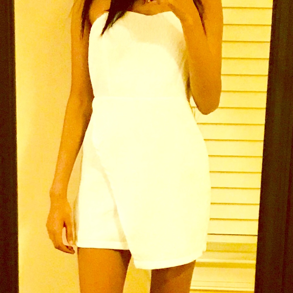 Asymmetrical strapless white mini dress